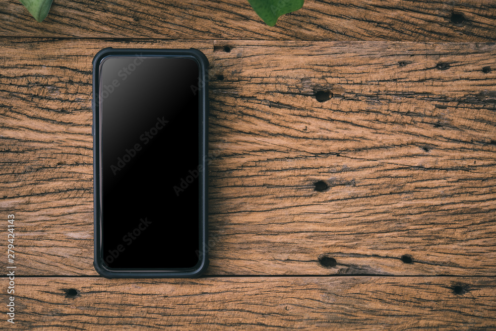 Aufkleber smart phone on wooden background with copy space. top view.