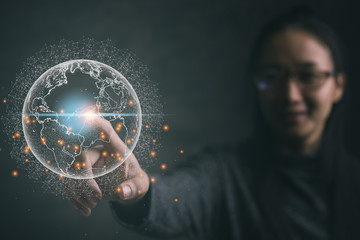 Businesswoman touching global network and data exchanges over the world.