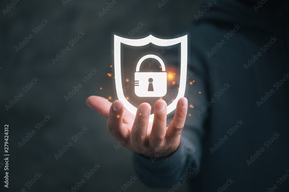 Aufkleber man holding virtual icon shield with a lock symbol, concept about security, cybersecurity and protec