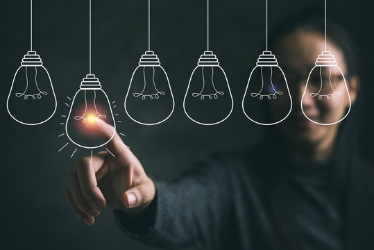 Businesswoman pointing light bulb