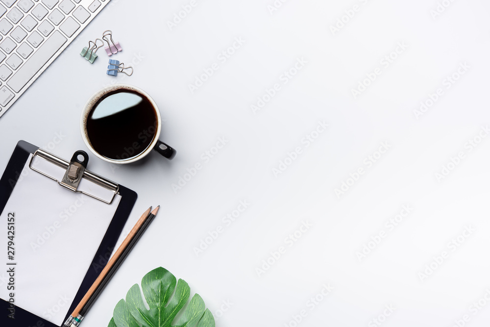 Aufkleber modern white office desk table with keyboard, and other supplies with cup of coffee. blank notebook 