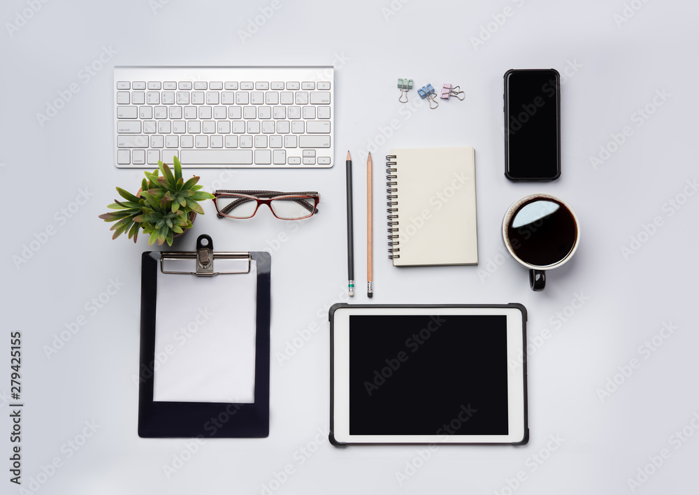Poster top view of white office desk table with laptop, smartphone and other supplies with cup of coffee. b