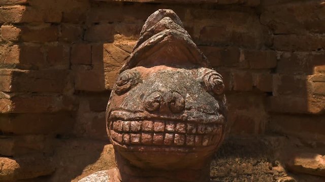 An extreme close up shot of the statue of an animal's head