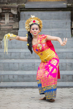 Female Pendet Dancer Carries Flower Petals