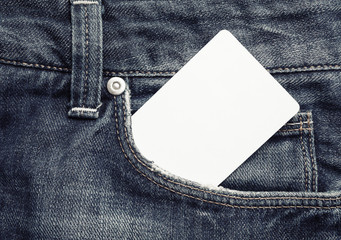 Photo of blank white bank card in jeans pocket. White credit card.