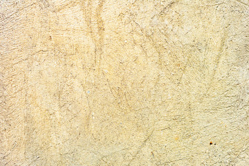 Texture of a concrete wall with cracks and scratches which can be used as a background
