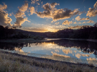 Fototapeta na wymiar Panoramic Reservoir Sunset with Reflection and Beautiful Sky