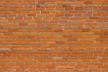 Shabby chic old deteriorating red clay brick wall background texture