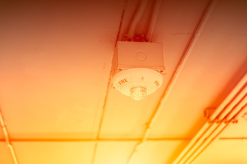 Fototapeta na wymiar flame detector device hot fire and smoke sensor at ceiling roof.