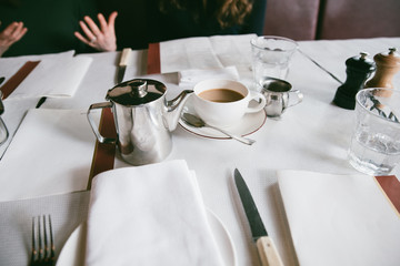 clean table setting with a cup of coffee
