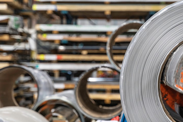 Roll of galvanized steel cutting machine, ironworks and metalwork factory for production of metal and steel roofing.