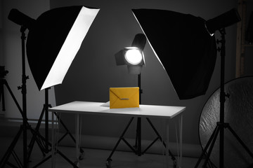 Professional photography equipment prepared for shooting stylish bag in studio