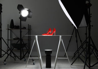 Professional photography equipment prepared for shooting stylish shoes in studio - obrazy, fototapety, plakaty