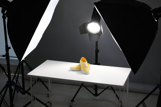Professional photography equipment prepared for shooting stylish shoes in studio