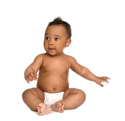 Adorable African-American baby in diaper on white background