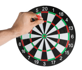 Young man throwing dart at board on white background, closeup
