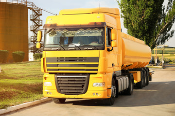 Fototapeta na wymiar Modern yellow truck parked on country road