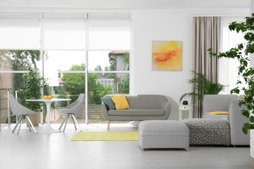 Living room with modern furniture and stylish decor. Color ideas for interior