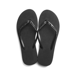 Pair of stylish flip flops on white background, top view