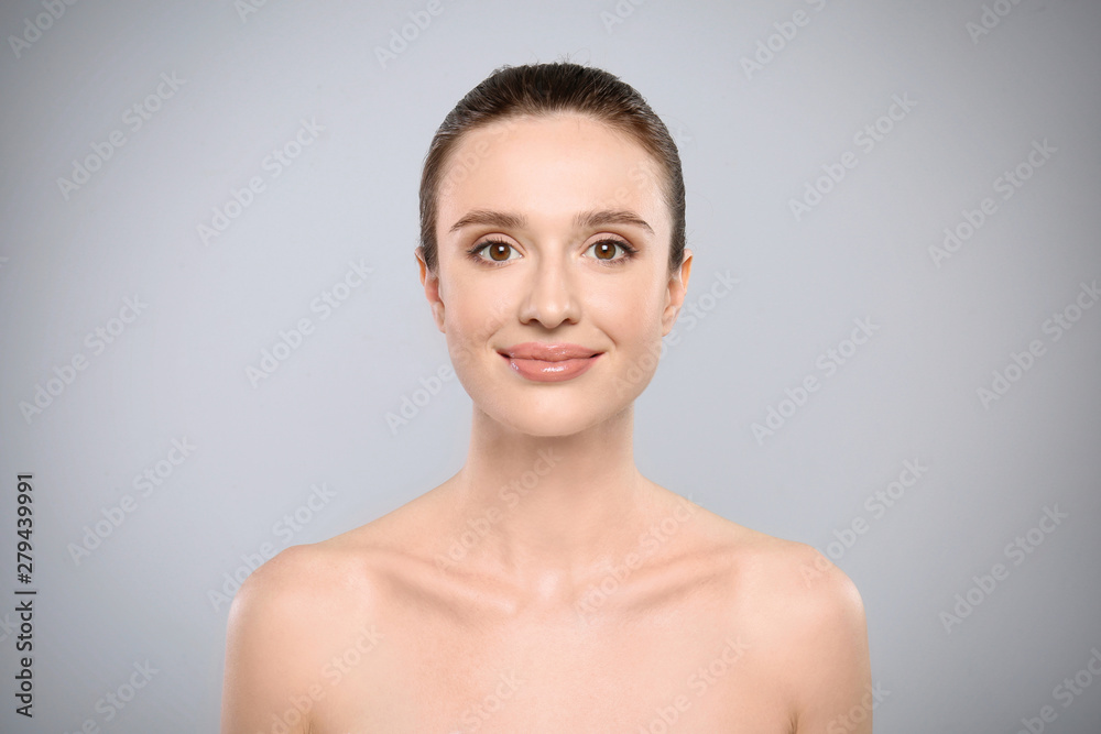 Sticker Portrait of beautiful young woman with perfect skin on grey background. Spa treatment