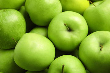 Fresh ripe green apples as background, closeup view