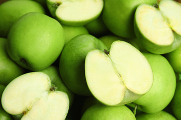 Fresh ripe green apples as background, closeup view