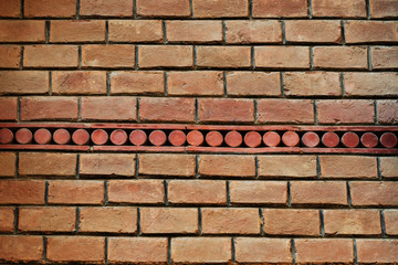 The texture of the old brick wall with a mosaic of the 19th century