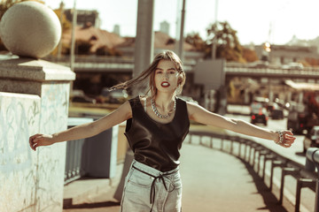 Fototapeta premium Active long-haired photo model spreading hands and rolling around