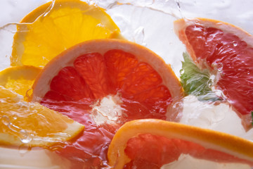 Naklejka na ściany i meble Fresh orange in a spray of water