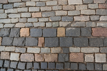 Texture of old colorful square paving stones