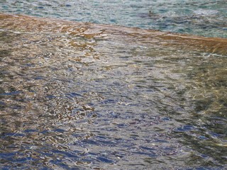 Waters creating ripples in a pond