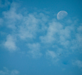 blue sky with clouds and moon