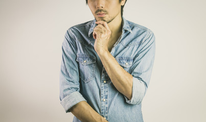 Jeans Shirt or Denim Shirt Man Fashion Front View with Man Touch Chin Pose in Vintage Tone