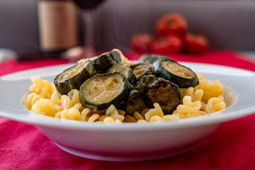 Italian food: pasta with zucchini and parmesan