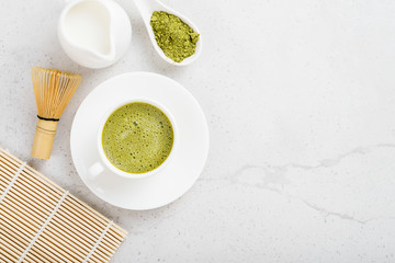 Matcha green tea latte with coconut milk. Top view.