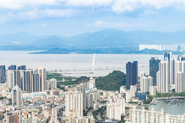 Fototapeta premium Shenzhen Nanshan District, Shenzhen, China residential real estate and Shenzhen Bay Bridge