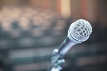 Microphone over the blurred business forum Meeting or Conference Room Concept, Blurred background.