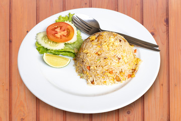 Fried rice with pork and vegetable on dish, Thai cuisine.