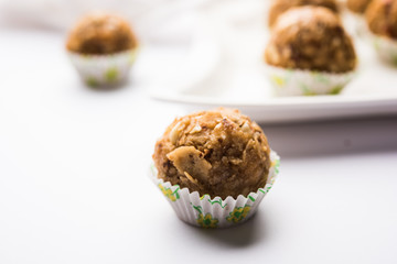 Leftover chapati Laddu / Churma Laddoo or Policha Ladu made with Roti, peanuts, dry fruits and jaggery. selective focus 