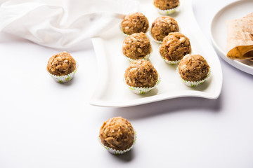Leftover chapati Laddu / Churma Laddoo or Policha Ladu made with Roti, peanuts, dry fruits and jaggery. selective focus 
