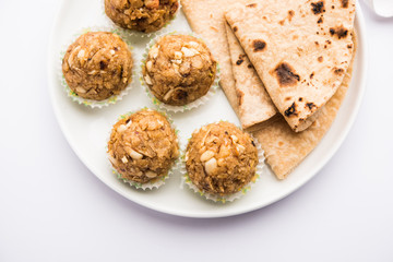 Leftover chapati Laddu / Churma Laddoo or Policha Ladu made with Roti, peanuts, dry fruits and jaggery. selective focus 