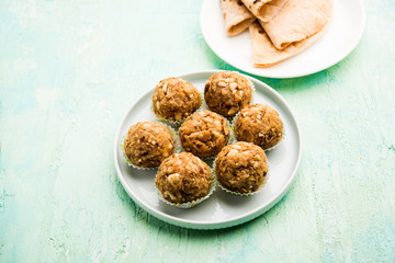 Leftover chapati Laddu / Churma Laddoo or Policha Ladu made with Roti, peanuts, dry fruits and jaggery. selective focus 