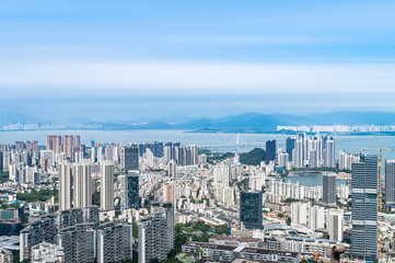 Fototapeta premium Shenzhen Nanshan District, Shenzhen, China residential real estate and Shenzhen Bay Bridge