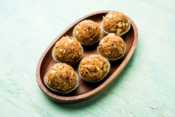 Leftover chapati Laddu / Churma Laddoo or Policha Ladu made with Roti, peanuts, dry fruits and jaggery. selective focus 