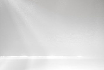 Light and shadow in the backdrop of an open white room