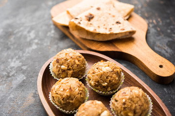 Leftover chapati Laddu / Churma Laddoo or Policha Ladu made with Roti, peanuts, dry fruits and jaggery. selective focus 