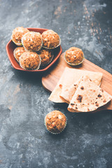 Leftover chapati Laddu / Churma Laddoo or Policha Ladu made with Roti, peanuts, dry fruits and jaggery. selective focus 