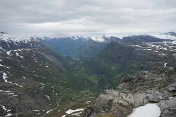 Fototapeta na wymiar Panoramic view at Geiranger village and fjord from Dalsnibba which offers a Europe's highest fjord view from a road and is therefore a popular tourist destination. Scandinavia, Europe.