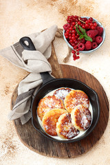 Cottage cheese pancakes Russian syrniki with  berries
