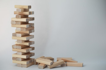 Board game jenga tower of wood sticks